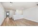Open-concept living room featuring neutral colors and wood-look floors at 9099 Nostrand Ave, Las Vegas, NV 89148