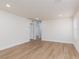 Spacious living room boasts wood-look flooring and neutral paint at 9099 Nostrand Ave, Las Vegas, NV 89148