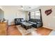 Living room featuring laminate flooring and modern decor at 10106 Hollis Mountain Ave, Las Vegas, NV 89148