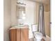 Standard bathroom with a single vanity, mirror, lighting, toilet, and shower with curtain at 1381 E University Ave # 204, Las Vegas, NV 89119