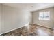 The bedroom includes a window providing natural light and unique flooring at 1381 E University Ave # 204, Las Vegas, NV 89119
