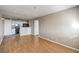 Open-concept living area with hard wood floors leading to the kitchen at 1381 E University Ave # 204, Las Vegas, NV 89119