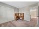 Neutral bedroom with a built-in wooden desk and sliding door closet at 194 Carlsbad Caverns St, Henderson, NV 89012