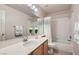 Clean bathroom featuring a vanity, mirror, and shower-tub combination at 1943 Chickasaw Dr, Henderson, NV 89002