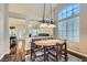 This dining area offers hardwood floors, a decorative light fixture, and tons of natural light at 1943 Chickasaw Dr, Henderson, NV 89002