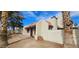 Exterior side view of townhome showcasing desert landscaping and a red tile roof at 2120 Venus Ave # A, North Las Vegas, NV 89030