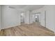 Spacious bedroom with an en-suite bathroom and wood-look flooring, offering comfort and convenience at 2573 Rafferty Creek Ln, Las Vegas, NV 89156
