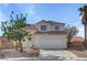 Charming two-story home with stucco siding, a red tile roof, and a two-car garage at 2573 Rafferty Creek Ln, Las Vegas, NV 89156