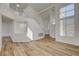 Bright living room with high ceilings, hardwood floors and modern staircase at 2573 Rafferty Creek Ln, Las Vegas, NV 89156