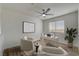 Bright office space with white furniture, modern lighting, and wood-look floors at 2573 Rafferty Creek Ln, Las Vegas, NV 89156