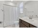 Clean and bright bathroom with a shower, vanity and neutral color scheme at 2713 Royal Tourist Rd, North Las Vegas, NV 89086