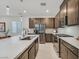 Contemporary kitchen featuring stainless steel appliances, quartz countertop and dark wood cabinets at 2713 Royal Tourist Rd, North Las Vegas, NV 89086