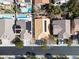 Aerial view of home with solar panels with access to pool and yard at 283 New River Cir, Henderson, NV 89052
