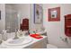 Well-lit bathroom with a white vanity at 283 New River Cir, Henderson, NV 89052