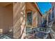 Inviting covered porch with comfortable seating and a decorative front door, perfect for relaxing at 283 New River Cir, Henderson, NV 89052