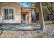 Charming single-story home featuring desert landscaping, a brick walkway, and a covered front porch at 283 New River Cir, Henderson, NV 89052