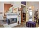 Charming living area with a fireplace, an adjacent dining area, and decorative touches throughout the space at 283 New River Cir, Henderson, NV 89052