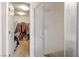 Large walk-in closet featuring installed shelving and hanging clothes at 283 New River Cir, Henderson, NV 89052