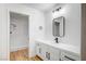 Bright bathroom featuring modern vanity with framed mirror and updated shower with glass door at 2851 S Valley View Blvd # 1079, Las Vegas, NV 89102