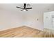 Bedroom featuring neutral walls, ceiling fan and wood-look flooring at 2851 S Valley View Blvd # 1079, Las Vegas, NV 89102