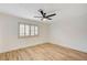 Bedroom with a ceiling fan, light walls and wood-look floors at 2851 S Valley View Blvd # 1079, Las Vegas, NV 89102