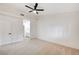 Spacious carpeted bedroom with a ceiling fan and a view of the en-suite bathroom at 2851 S Valley View Blvd # 1079, Las Vegas, NV 89102