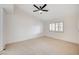 A carpeted bedroom with neutral walls, a modern ceiling fan, and a window with shutters at 2851 S Valley View Blvd # 1079, Las Vegas, NV 89102