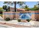 Welcoming entrance to Quail Estates West featuring a decorative fountain and seating area at 2851 S Valley View Blvd # 1079, Las Vegas, NV 89102