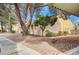 Charming condo with well-maintained landscaping, mature trees, and exterior beige stucco at 2851 S Valley View Blvd # 1079, Las Vegas, NV 89102