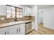 Sunlit kitchen features stainless steel appliances, granite countertops and wood-look floors at 2851 S Valley View Blvd # 1079, Las Vegas, NV 89102