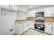 Bright kitchen with white cabinets, granite counters, and modern, updated appliances at 2851 S Valley View Blvd # 1079, Las Vegas, NV 89102