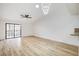 Spacious living room with wood floors, ceiling fan, modern light fixture and sliding glass doors at 2851 S Valley View Blvd # 1079, Las Vegas, NV 89102