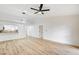 Bright living area showcasing wood-look flooring, modern light fixtures, and a breakfast bar to the kitchen at 2851 S Valley View Blvd # 1079, Las Vegas, NV 89102