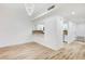 Open-concept living room features wood floors, a modern light and a kitchen pass through at 2851 S Valley View Blvd # 1079, Las Vegas, NV 89102
