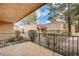 Relax on this private patio with community views, featuring a tiled surface and mature landscaping at 2851 S Valley View Blvd # 1079, Las Vegas, NV 89102