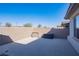 Open backyard with concrete area, enclosed by a brick wall for privacy and security at 294 Dedication Ave, Henderson, NV 89011