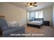 Upstairs primary bedroom featuring a ceiling fan, windows and neutral carpet at 294 Dedication Ave, Henderson, NV 89011