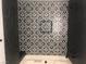 Close-up on black and white shower tile, demonstrating stylish and modern design at 2970 Juniper Hills Blvd # 102, Las Vegas, NV 89142