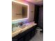 Bathroom features a modern vanity with countertop and decorative tile at 2970 Juniper Hills Blvd # 102, Las Vegas, NV 89142