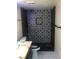 Stylish bathroom with black and white patterned tile and a modern toilet at 2970 Juniper Hills Blvd # 102, Las Vegas, NV 89142