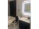 Bathroom with modern vanity and black and white shower tile at 2970 Juniper Hills Blvd # 102, Las Vegas, NV 89142