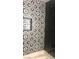 Up close view of sleek and stylish modern shower with black and white accents at 2970 Juniper Hills Blvd # 102, Las Vegas, NV 89142