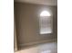 Bedroom featuring a window with blinds and tile floors at 2970 Juniper Hills Blvd # 102, Las Vegas, NV 89142