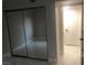 Bedroom with mirrored closet doors and tile floors at 2970 Juniper Hills Blvd # 102, Las Vegas, NV 89142
