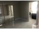Spacious bedroom showcasing tile flooring and adjacent bathroom at 2970 Juniper Hills Blvd # 102, Las Vegas, NV 89142