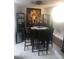 Cozy dining area features modern table set, and a large picture creating a inviting atmosphere at 2970 Juniper Hills Blvd # 102, Las Vegas, NV 89142