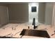 Open-concept kitchen view with marble countertops and a modern sink faucet at 2970 Juniper Hills Blvd # 102, Las Vegas, NV 89142