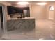 Modern kitchen showcasing marble floors, dark blue cabinets, white marble countertop, and stainless steel appliances at 2970 Juniper Hills Blvd # 102, Las Vegas, NV 89142