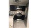 Well-equipped kitchen features stainless steel appliances, marble counters, and modern finishes at 2970 Juniper Hills Blvd # 102, Las Vegas, NV 89142