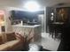 Open-concept kitchen with stainless steel appliances and a bright white marble counter with barstool seating at 2970 Juniper Hills Blvd # 102, Las Vegas, NV 89142